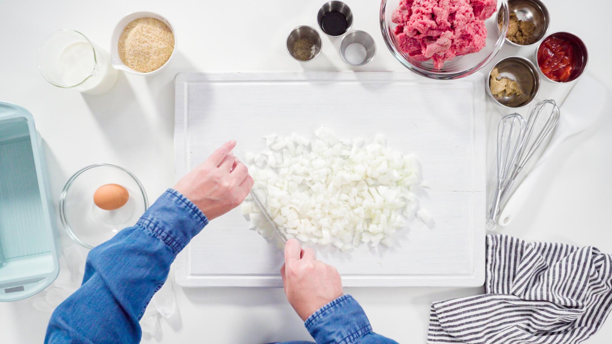 Chef arranging ingredients in a pastel kitchen